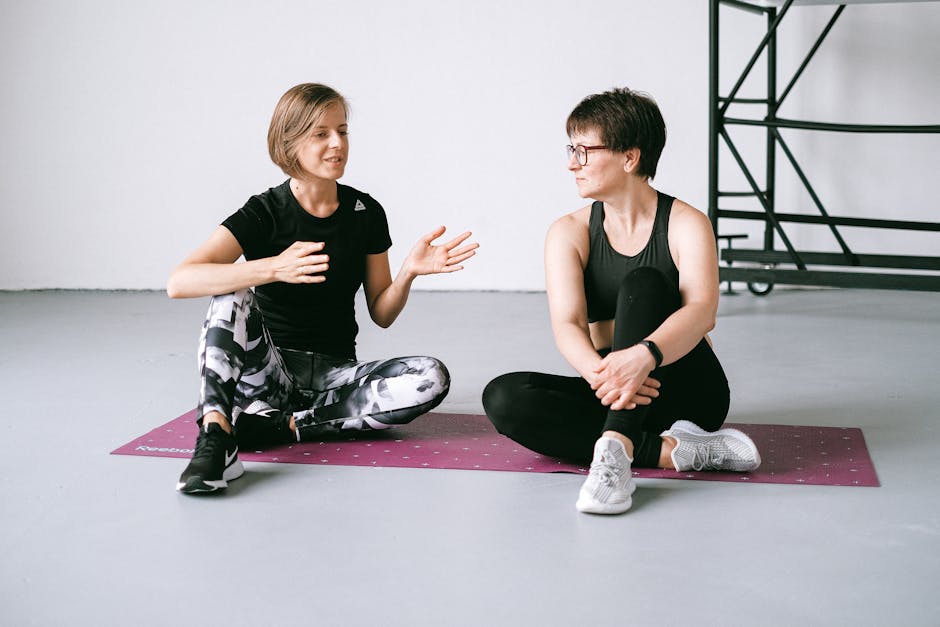 A vibrant and engaging image of a personal trainer conversing with a potential client in a gym setting, illustrating the importance of communication and lead qualification.
