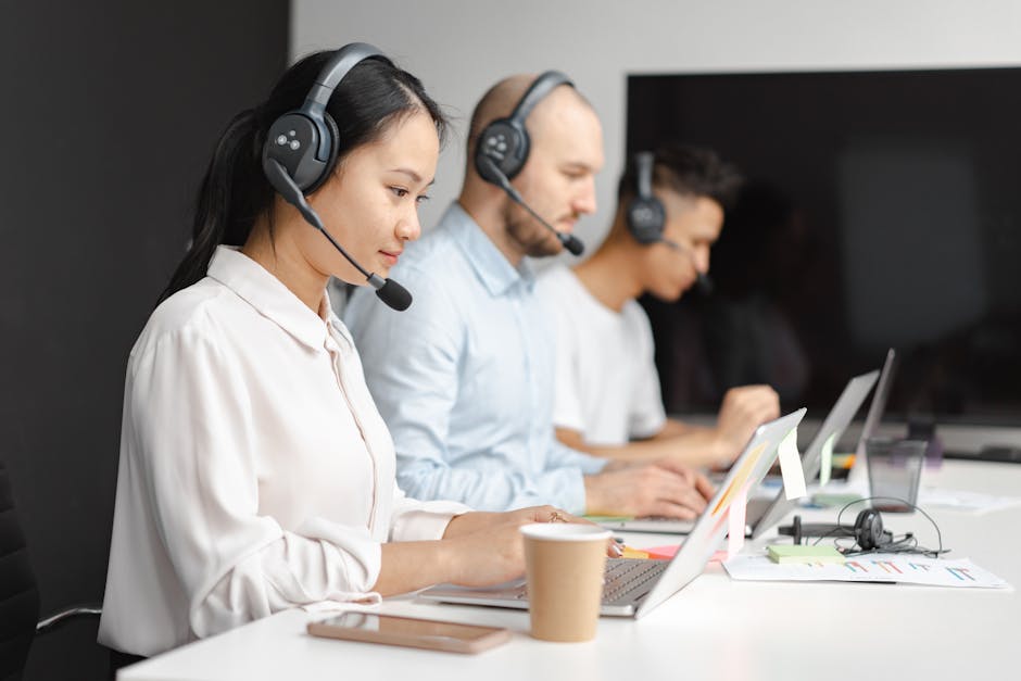 A busy call center with agents using AI technology to assist customers effectively.