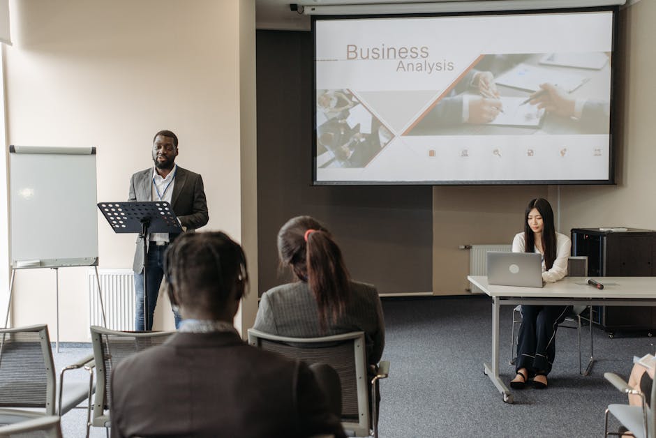 A dynamic training session in progress, showcasing employees engaged in mock phone calls with effective communication strategies displayed on a screen.