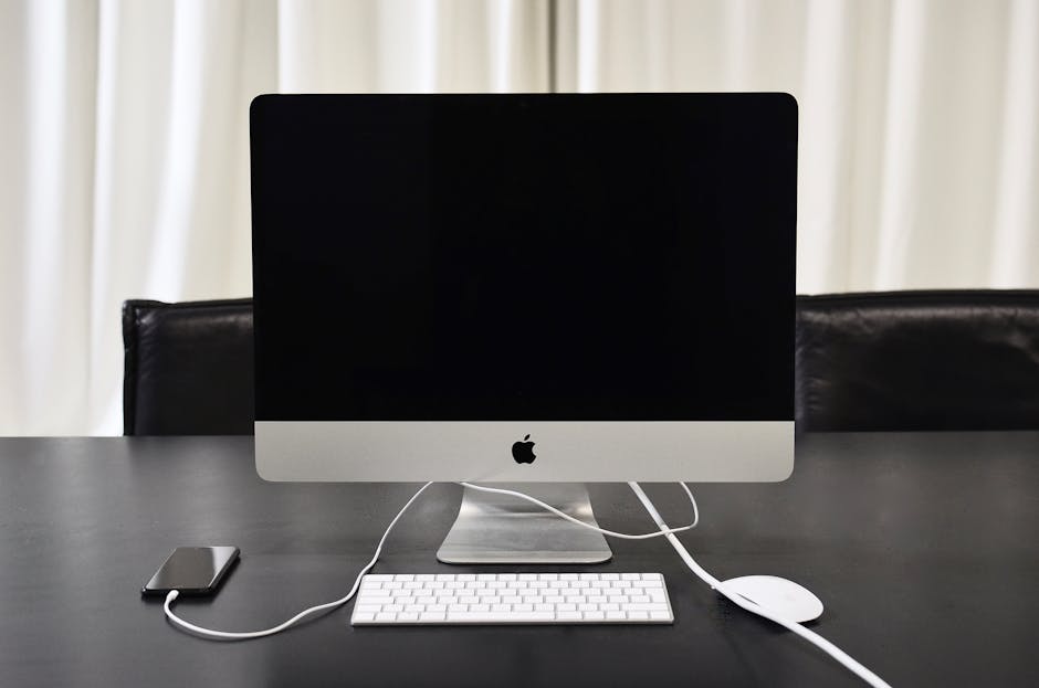 A modern office setup showcasing a sleek business phone system with a custom number displayed prominently.