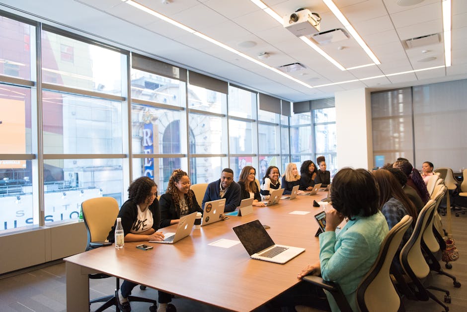 A vibrant office setting showing a team discussing customer engagement strategies, emphasizing business communication technology.