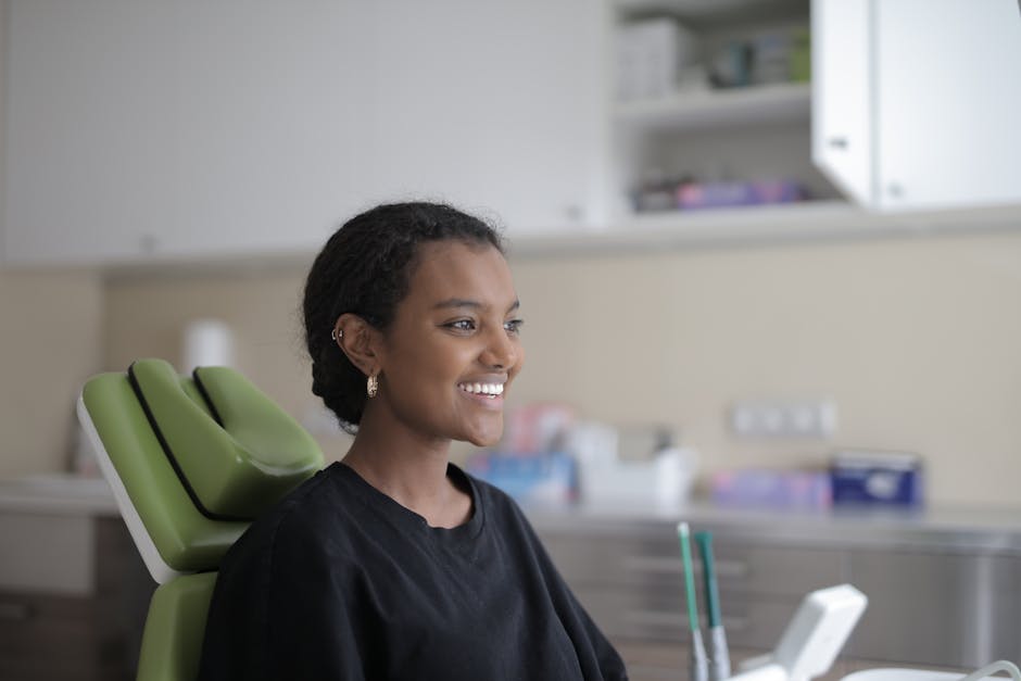 Image showing a modern, inviting dental office with cheerful staff interacting warmly with patients, emphasizing comfort and aesthetics.