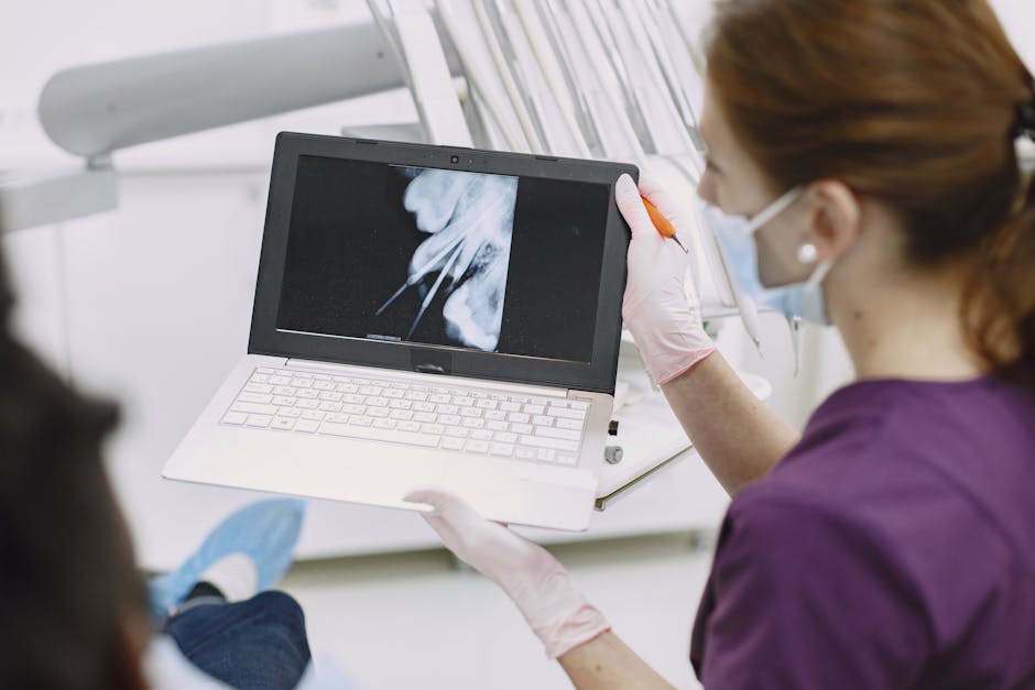 Image of a dental practice staff member engaging with a patient via text message, alongside a laptop displaying an email marketing dashboard.
