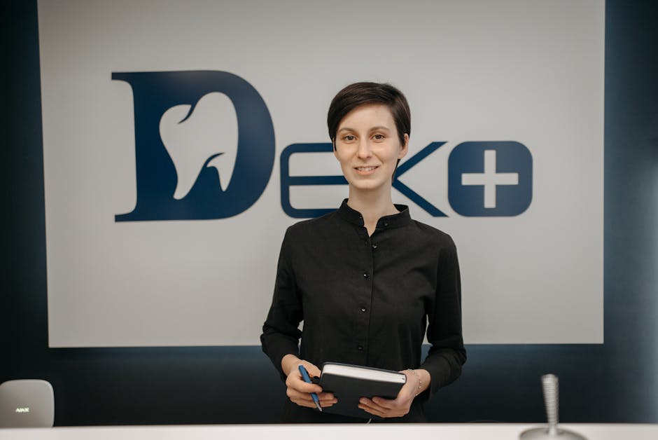 A warm, welcoming dental office with a friendly receptionist ready to assist patients, showcasing a comfortable environment for returning patients.