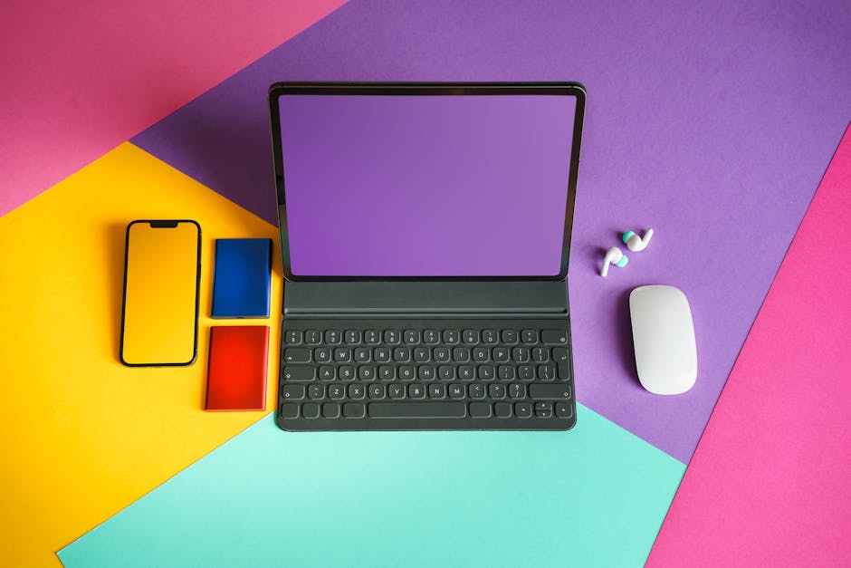 A vibrant workspace with a mobile phone displaying a VoIP app, surrounded by business tools and a laptop