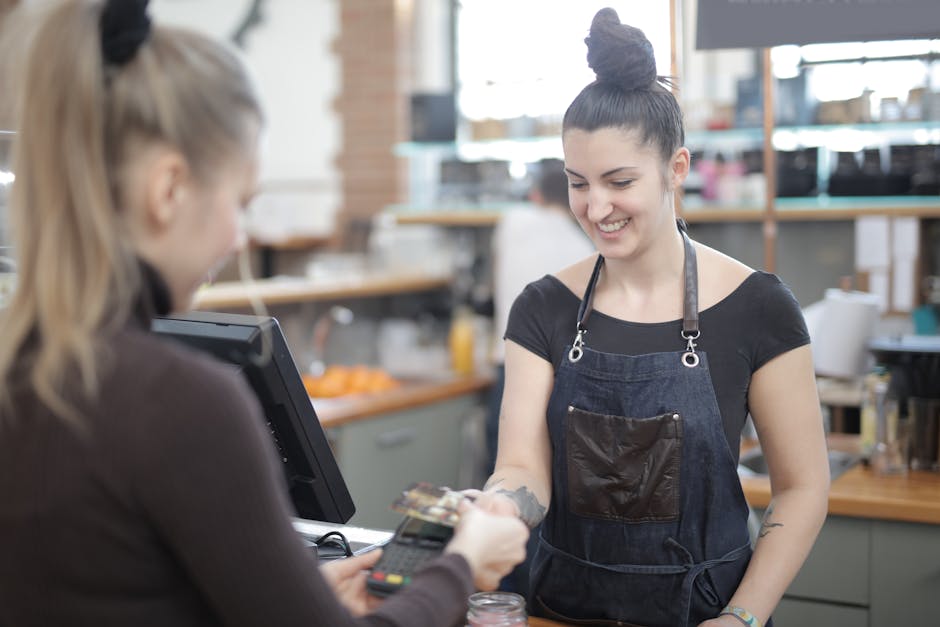 A retail employee assisting a customer with a return, showing a smooth and friendly interaction that highlights the returns process.