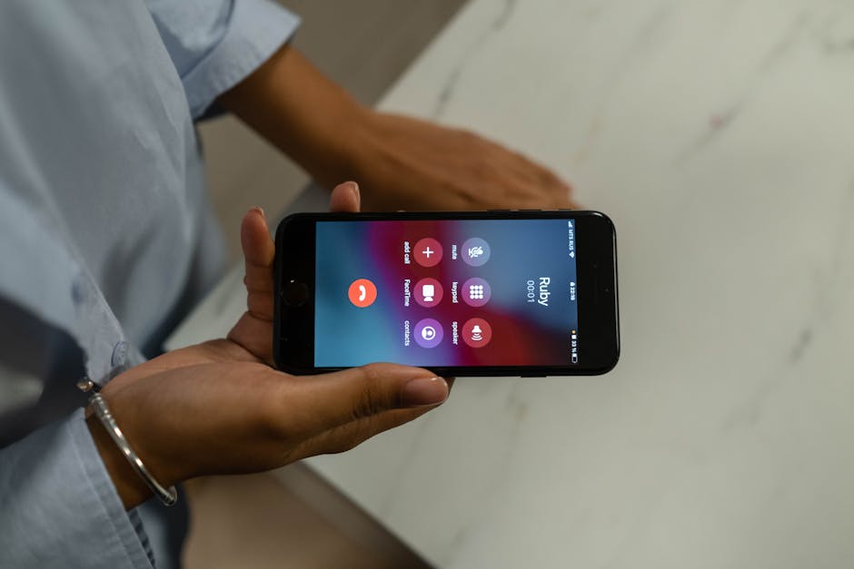 A close-up of a smartphone displaying the recent calls list, highlighting the redial feature.