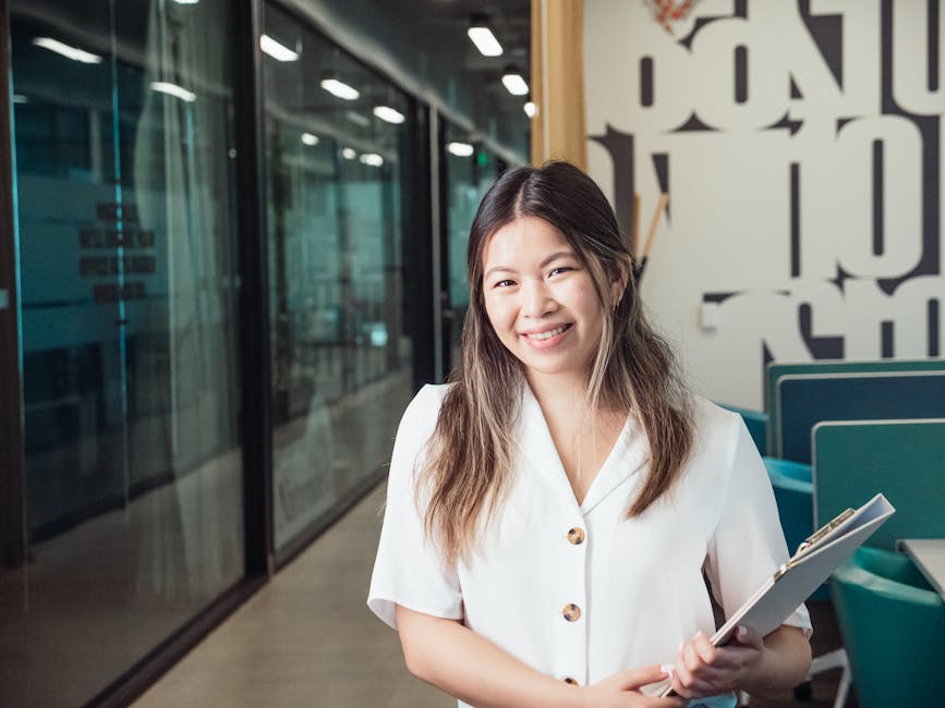A vibrant office scene with a professional on the phone, showcasing branded materials and a welcoming atmosphere.