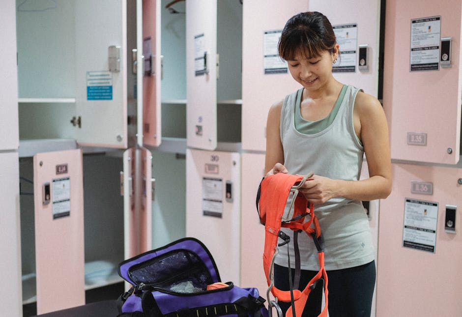 A dynamic and engaging image showing a phone agent at work in a vibrant indoor rock climbing gym, interacting with customers while surrounded by climbing gear and workout equipment.