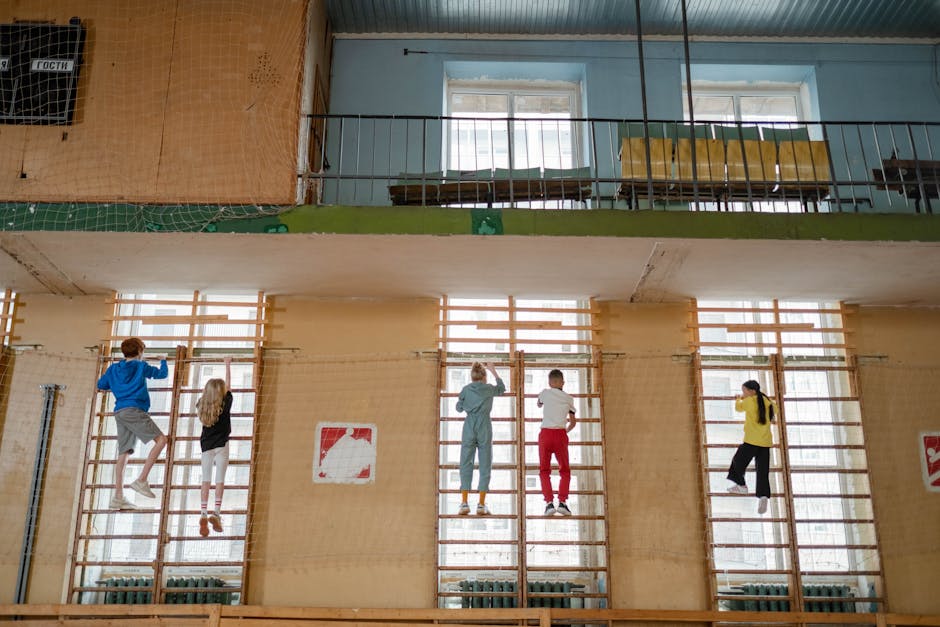 A vibrant indoor rock climbing gym scene with diverse climbers enjoying their activity.