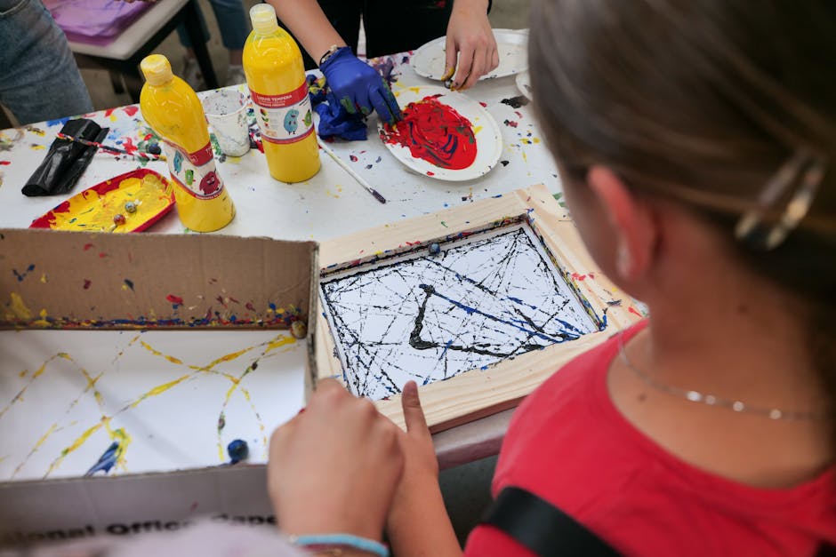 An inviting art studio with students actively engaged in a painting class, showcasing a vibrant and creative atmosphere.