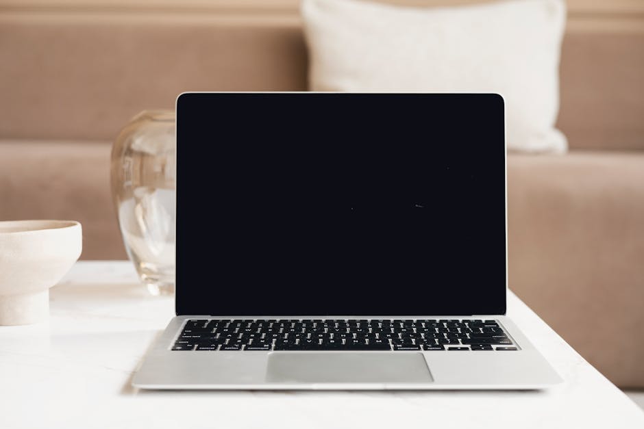 A sleek home office setting with a modern desk, computer, and design materials, representing the intersection of technology and interior design.