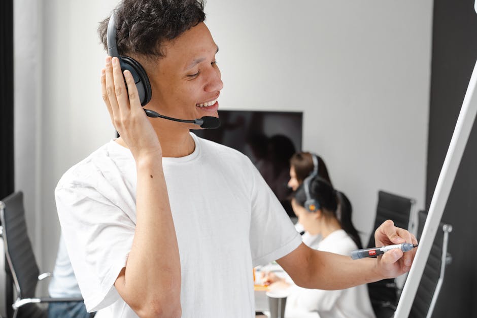 A phone agent speaking with a customer while taking notes on a notepad, symbolizing clear communication and effective lead qualification.
