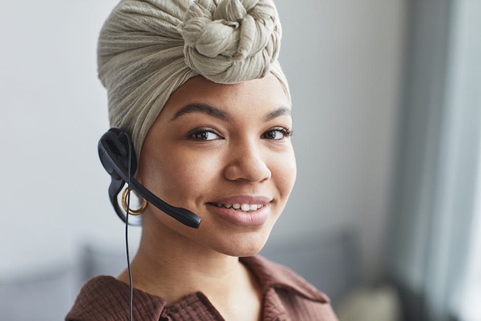 Image of a friendly phone agent talking to a customer, with a cluttered room in the background, showcasing a junk removal scenario.