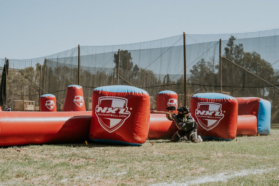 A high-energy scene of a paintball match, showcasing enthusiastic players in action, illustrating the excitement of the paintball experience.