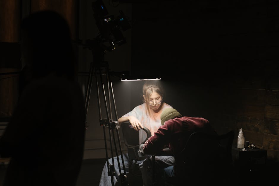 A tattoo artist interacting with a client over the phone, showcasing a warm and inviting atmosphere