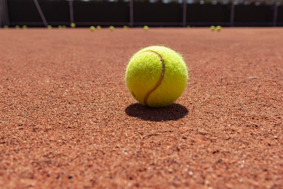 An engaging scene of a tennis coach discussing training options with a student over the phone while referencing a tennis court background.