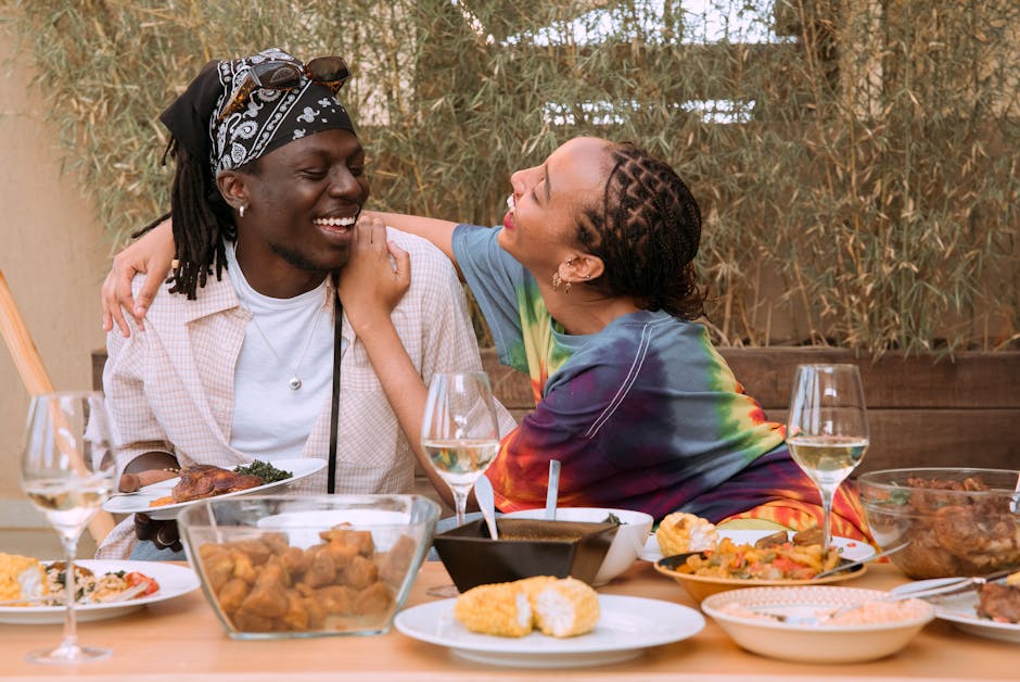 A vibrant photograph of a couple enjoying a wine tasting session, surrounded by beautiful vineyards, with a staff member engaging them in conversation.