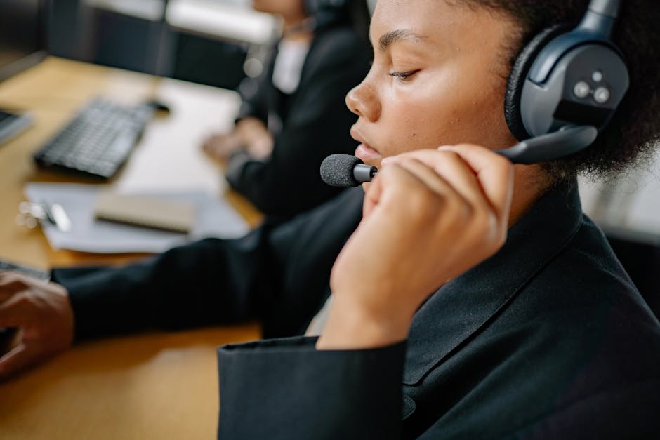 A professional phone agent speaking with clients in a cozy office environment, showcasing a welcoming atmosphere.