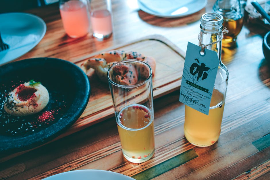 A vibrant image of a phone agent discussing kombucha options with a customer, surrounded by various kombucha flavors on a table.