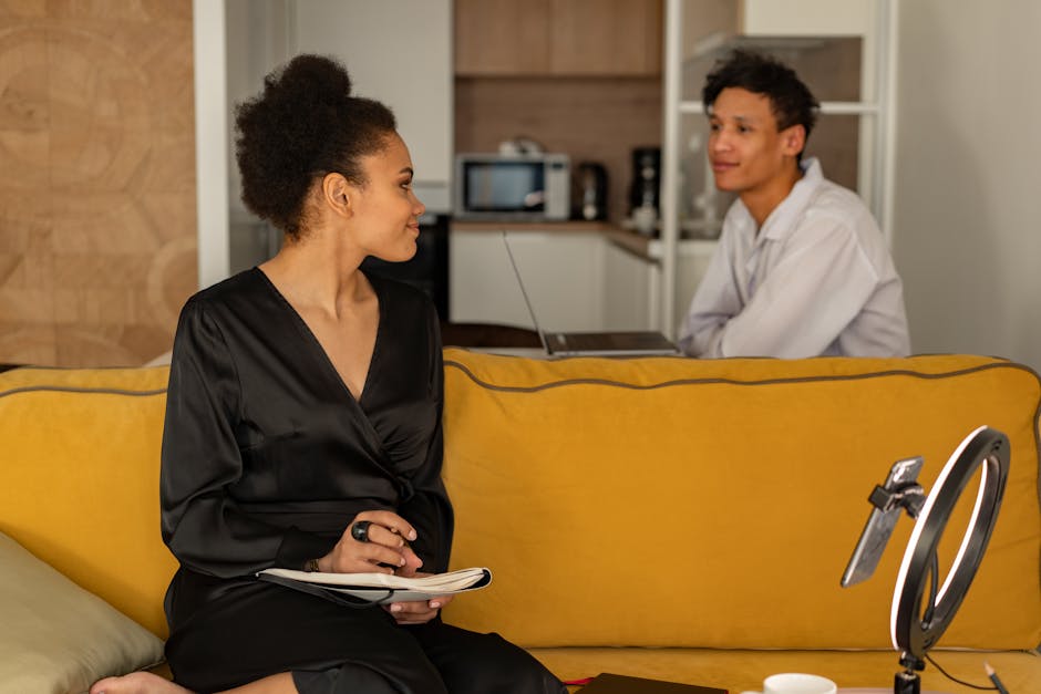 A dedicated phone agent on a call, surrounded by notes and a laptop, engaged in conversation about social media strategies with a prospective client.