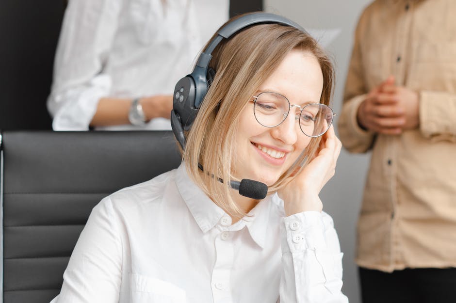 A friendly and professional phone agent speaking with a customer about their moving needs, with a notepad in hand to jot down important details.