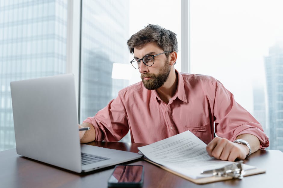 An image depicting a focused phone agent engaged in a conversation, with graphs and data points emerging from a computer screen nearby.