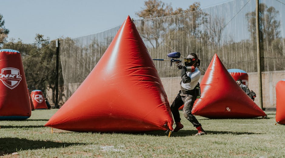 An image of a paintball field with enthusiastic players gearing up, symbolizing the excitement and engagement of the sport.