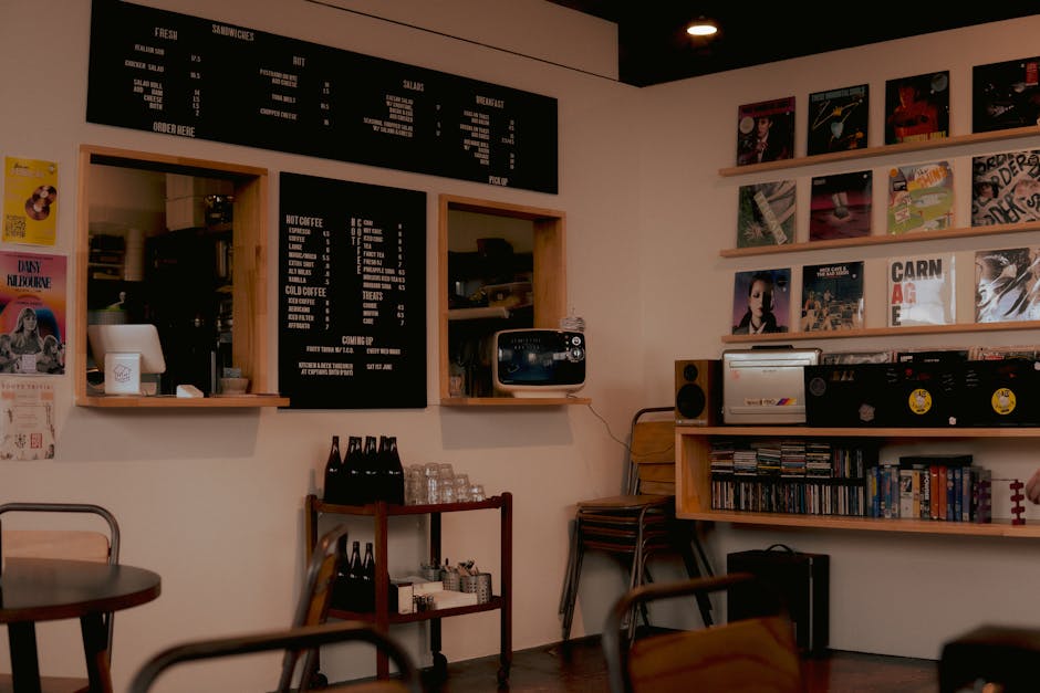 An engaging photo of a phone agent speaking with a customer, surrounded by vinyl records, creating a warm and inviting atmosphere.