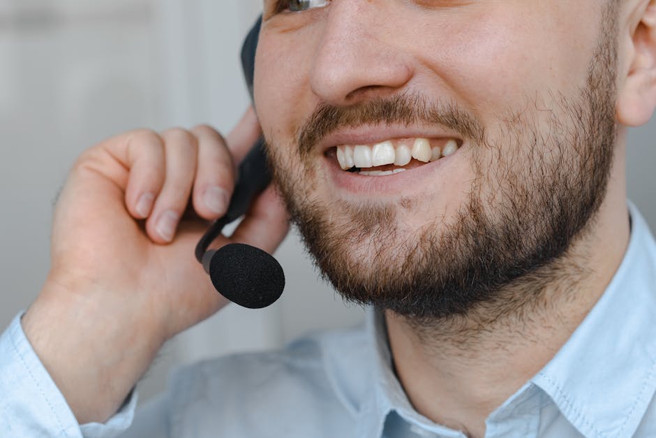 An illustration of a friendly phone agent speaking with a customer, taking notes during the call.