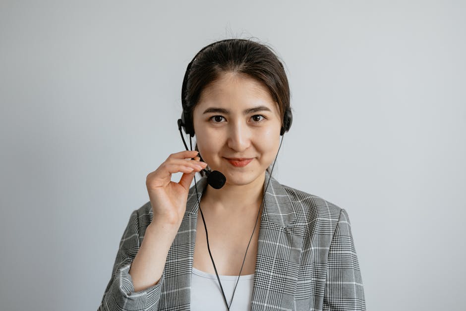 A busy dry cleaning business with a friendly agent on the phone, engaging with customers.