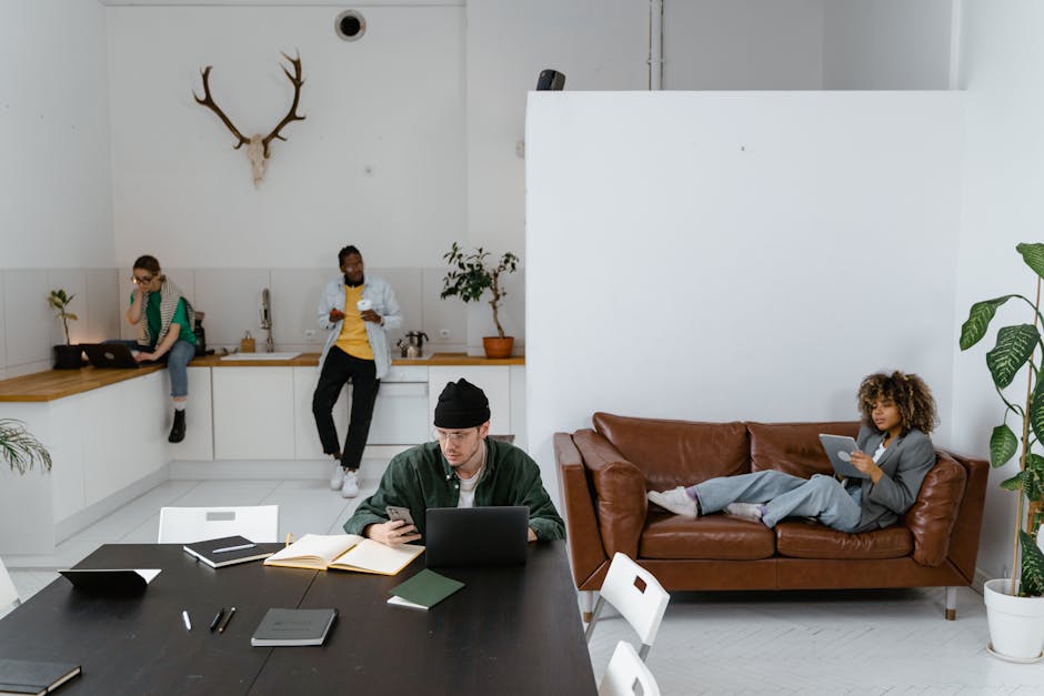 A vibrant office setting with team members communicating via their cell phones, showcasing adaptability.