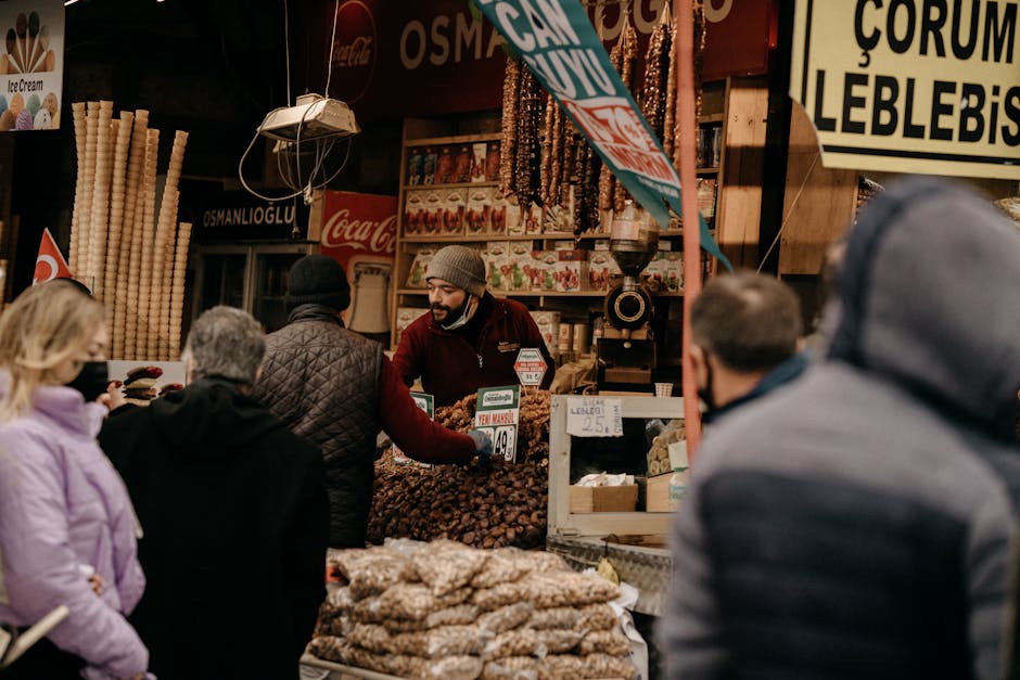 A vibrant farmer's market scene featuring a coffee roaster and a bakery with customers sampling products.