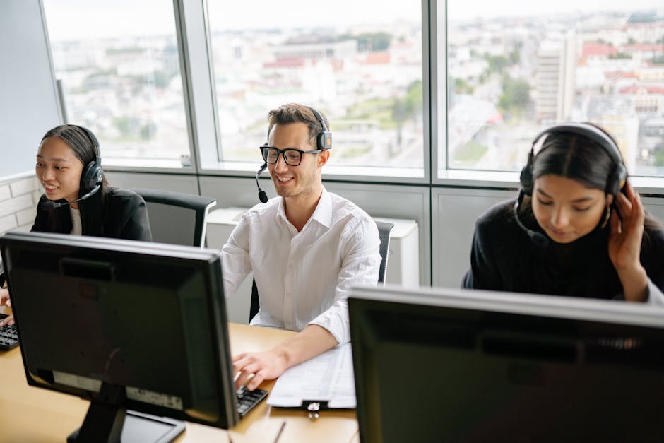A dynamic call center scene showing agents engaged with customers, highlighting collaboration and technology.