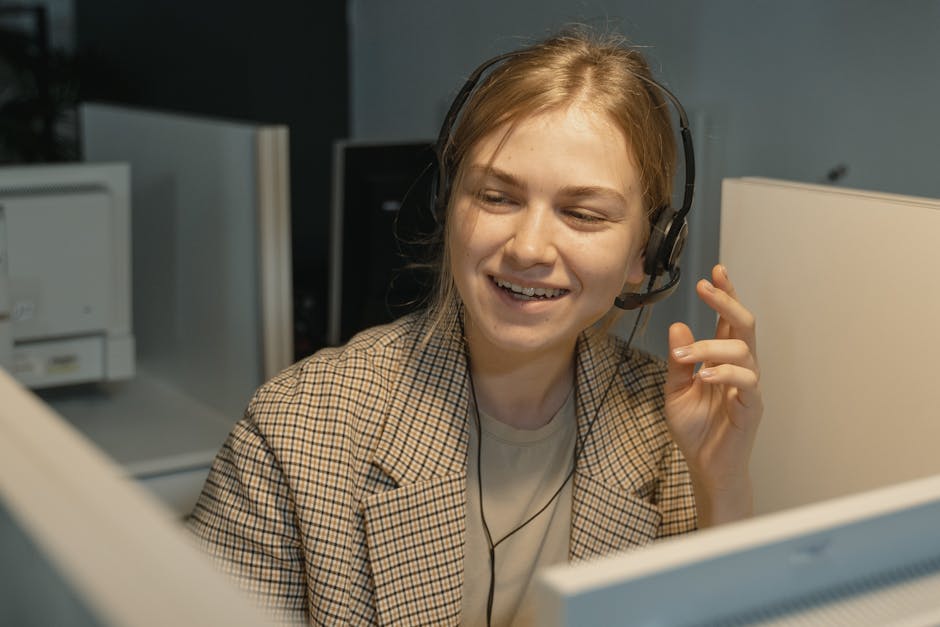 A vibrant call center with a representative smiling and engaging actively with a call.