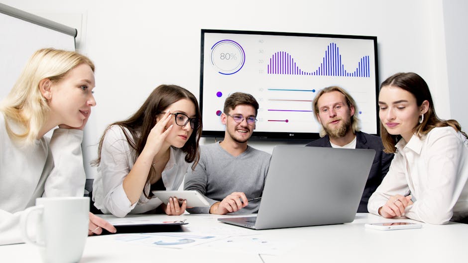 A vibrant image showing a diverse team in a modern office, with data visualizations on screens, brainstorming around a table, showcasing collaboration and technology in lead management.