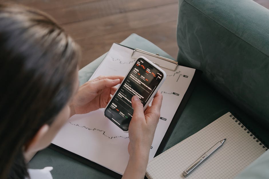 An engaging visual of a business professional using a smartphone with a graph of rising engagement metrics behind them