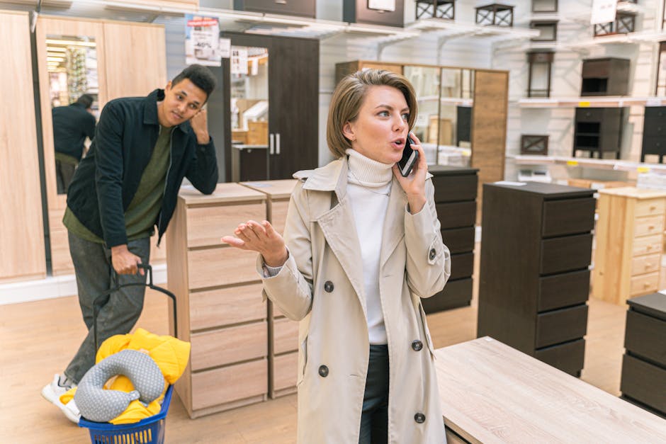 A customer service representative engaging in a conversation, looking thoughtful while listening to a voicemail on a phone.
