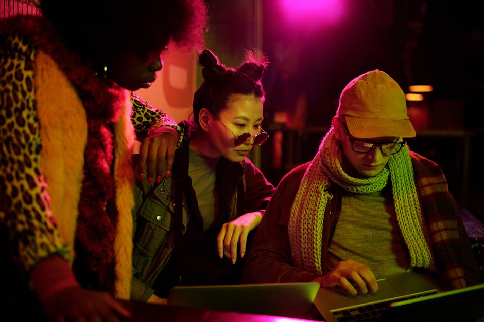 A vibrant teamwork scene featuring diverse individuals collaborating over a digital interface, symbolizing effective communication.