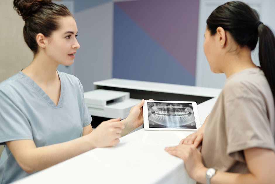 An image showing a healthcare professional using a VOIP phone while having a secure conversation with a patient.