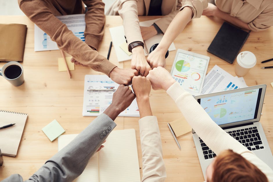 An illustration of a diverse team collaborating on business outreach using advanced VoIP technology, surrounded by charts indicating growth.