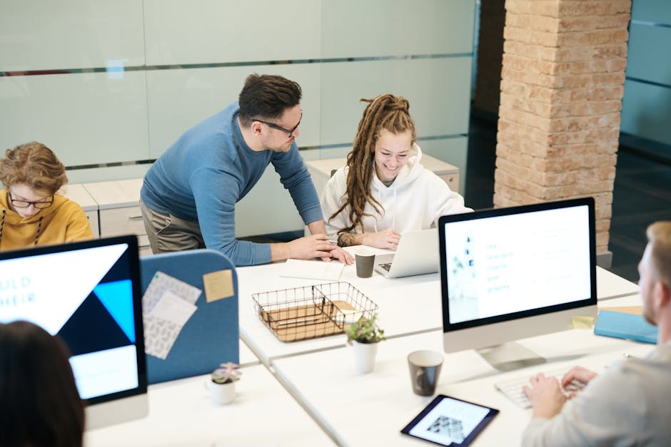 Image of a modern office setting with employees using VoIP phones, displaying a vibrant, collaborative atmosphere