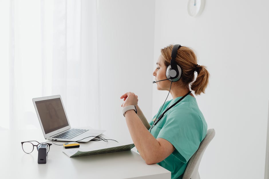 A dynamic office scene showing a professional using a headset while engaging with a computer displaying charts and call logs, symbolizing effective call handling.