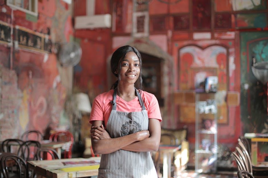 A vibrant image of a restaurant staff member checking reservations at a desk, communicating with a customer via a phone, with a bright, welcoming atmosphere in the background.