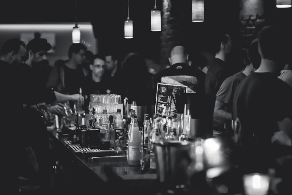 A bustling restaurant scene with waitstaff serving happy diners, showcasing the lively atmosphere that comes with well-managed reservations.