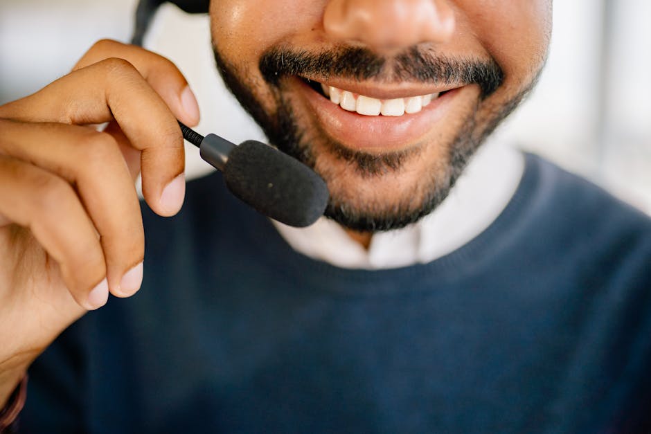 An empathetic customer service representative at a desk, actively engaging with voicemail technology, showcasing a thoughtful approach to customer calls.